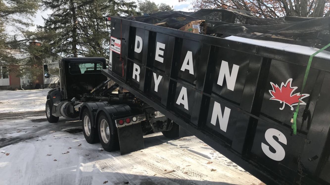 Truck delivering a Dean Ryans bin in winter