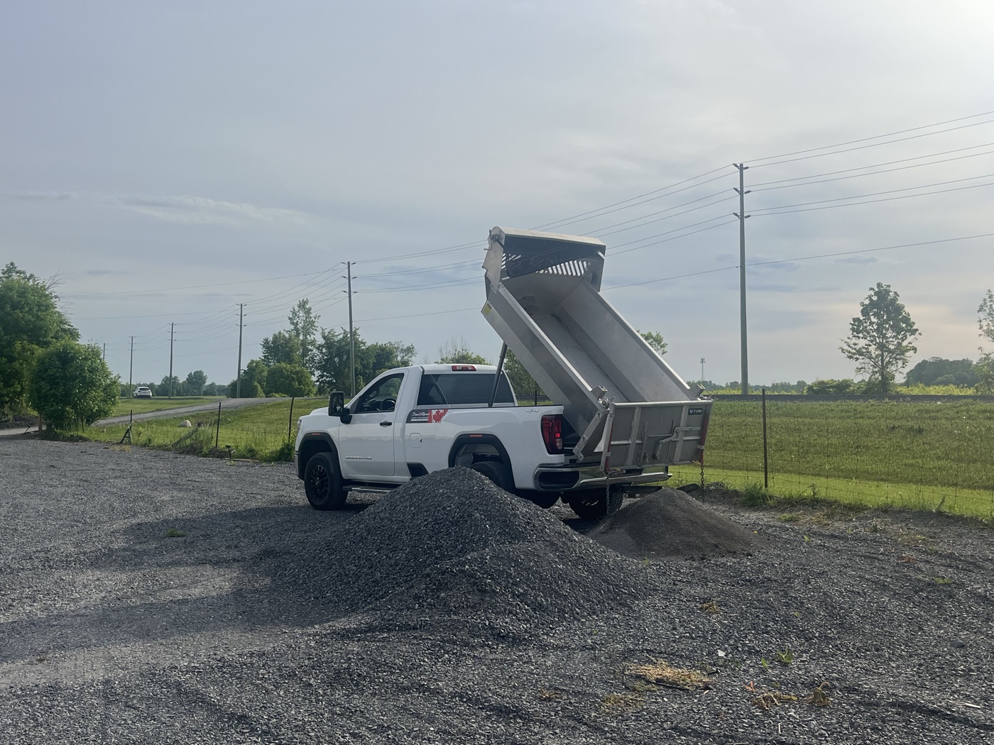 Dump truck delivering a load of gravel