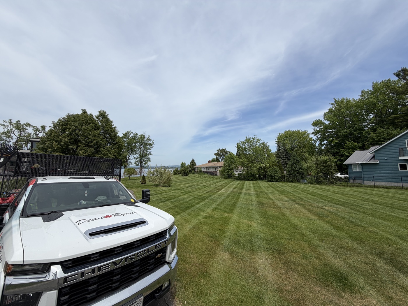 Freshly striped lawn with the Dean Ryans truck